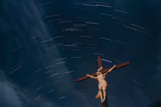 A dramatic crucifix stands against a swirling starry sky in Catas Altas, Brazil.