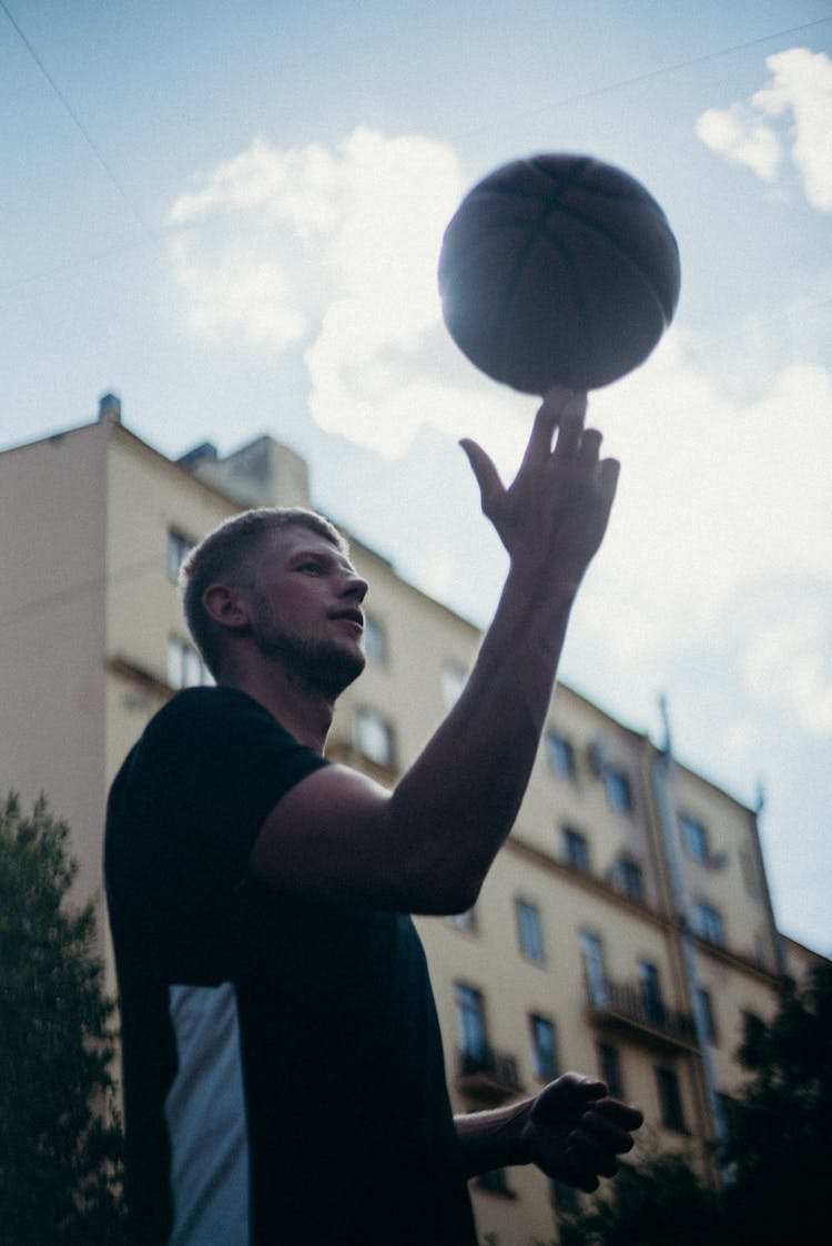 Man Spinning Ball On His Finger 