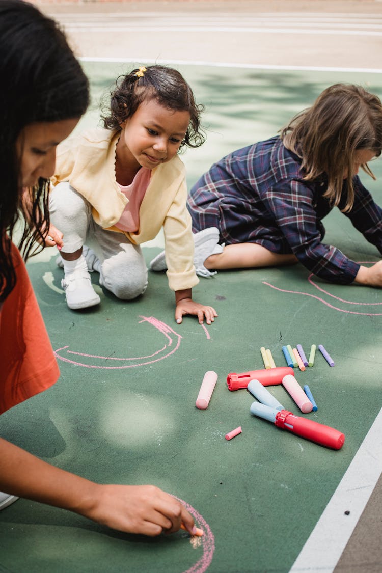 Children Drawing With Chalk