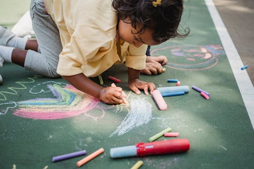 Free Girl Drawing with Chalk Stock Photo