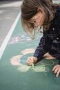 Girl in Blue and White Polka Dot Long Sleeve Shirt Playing on Green and White Map