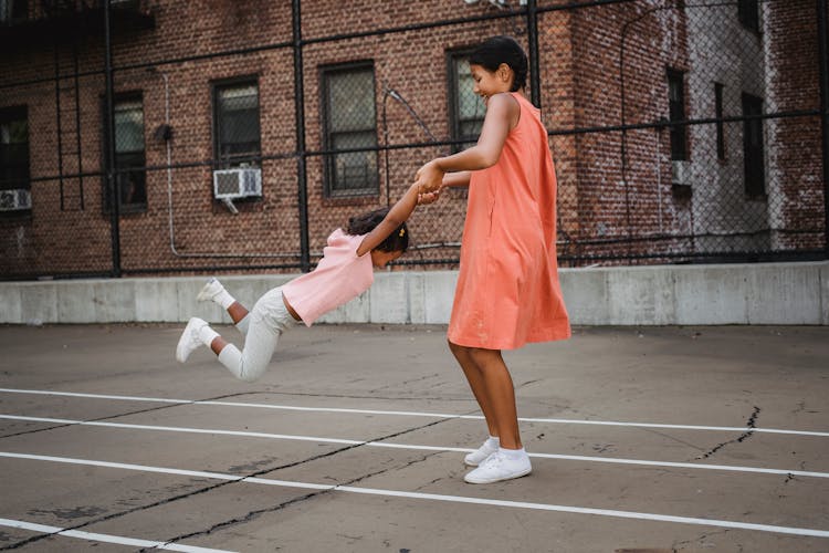 Girls Playing In The Yard