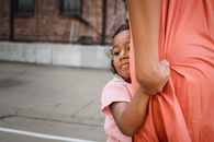 Girl in Pink Shirt and Orange Skirt