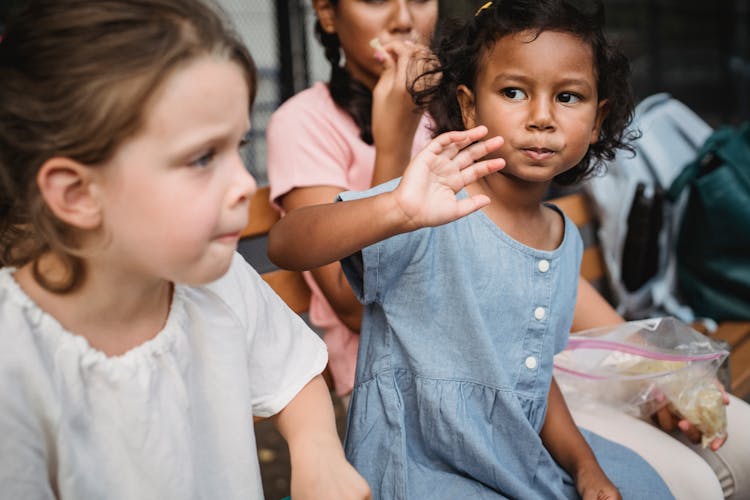 Little Girls Eating Snacks 