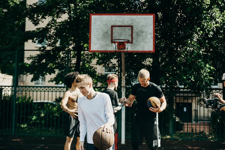 People Playing Basketball On The Street