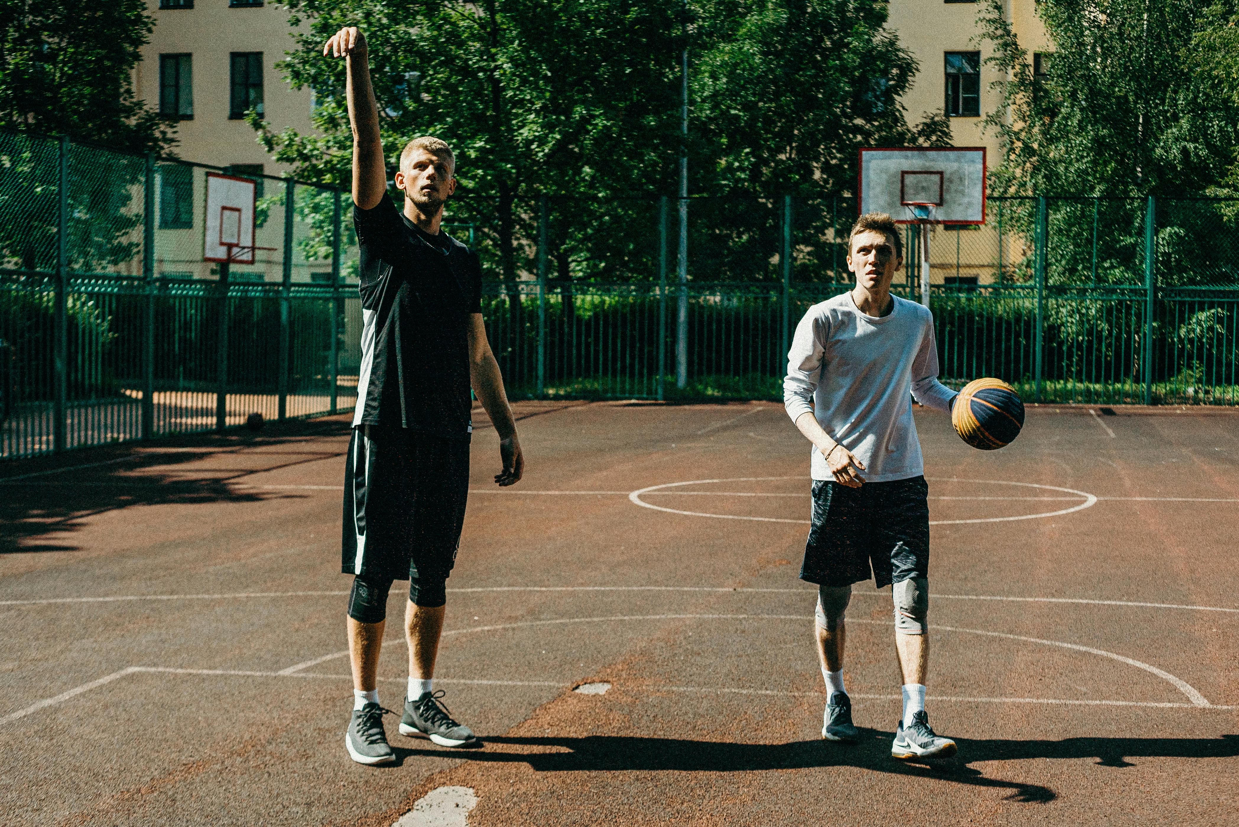 friends playing basketball