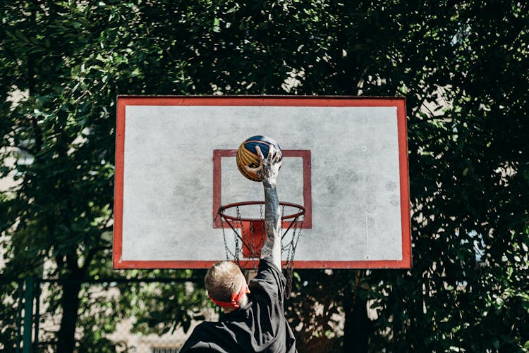 Man Dunking A Basketball