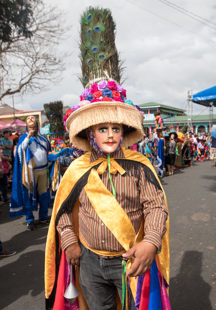 A Person In Festive Costume Standing On The Street