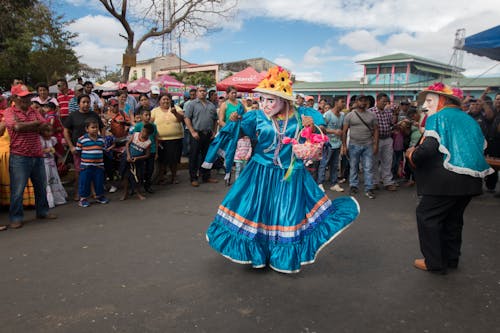 A Person in Festive Costume Dancing on the Street