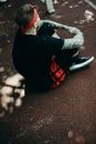 A Person in Black Shirt and Red Bandana