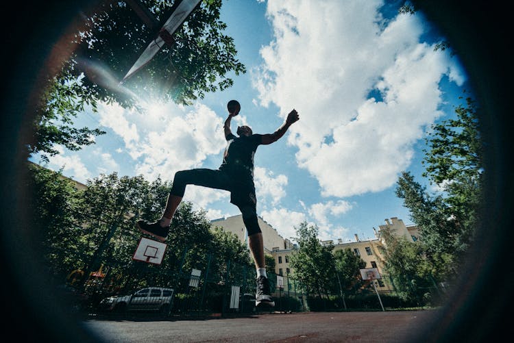 Jump Shot Of A Person Playing Basketball