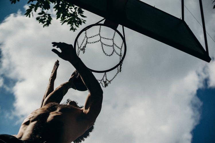 Low Angle Photography Of Basketball Dunk