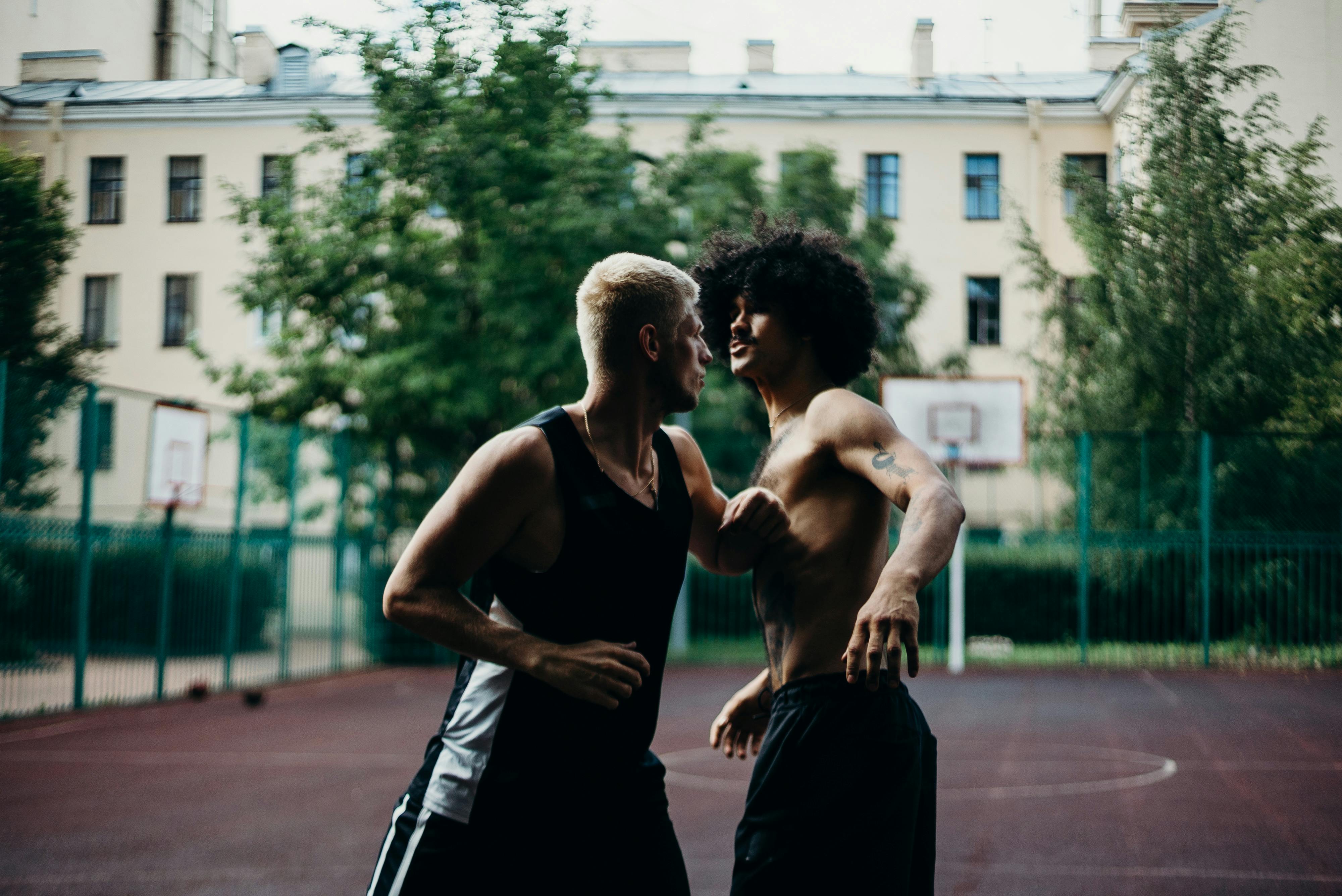 man in black tank top and black pants