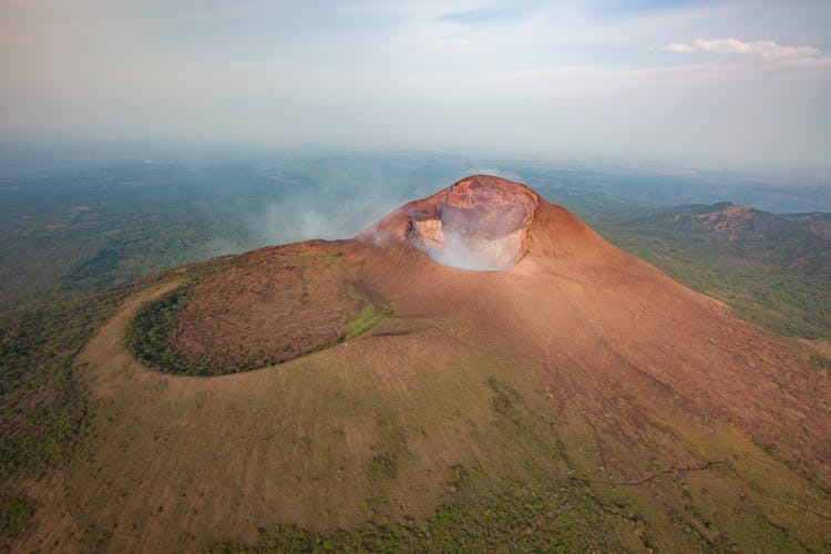 Brown And Green Mountain Under White Clouds