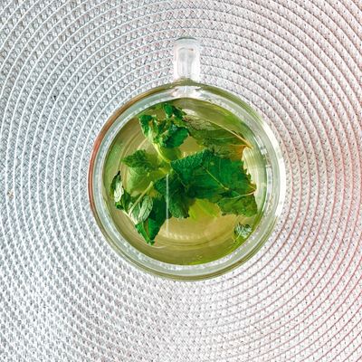 Herbal tea in a glass cup, top view — photo by Dina Nasyrova on Pexels