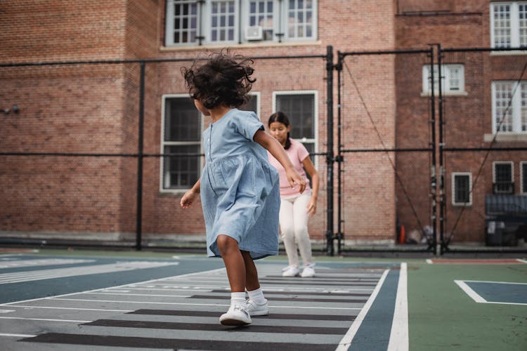 Girls Jumping Playing Outdoor Game