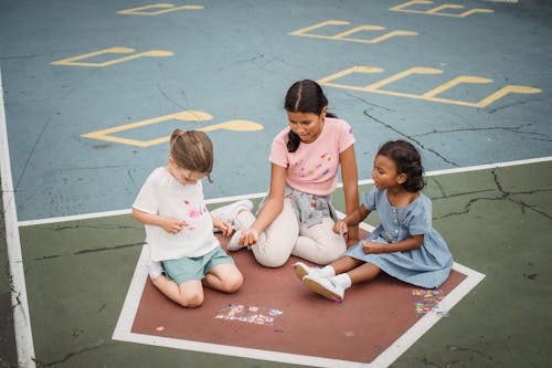 Free Little Girls Playing with Chalk Stock Photo