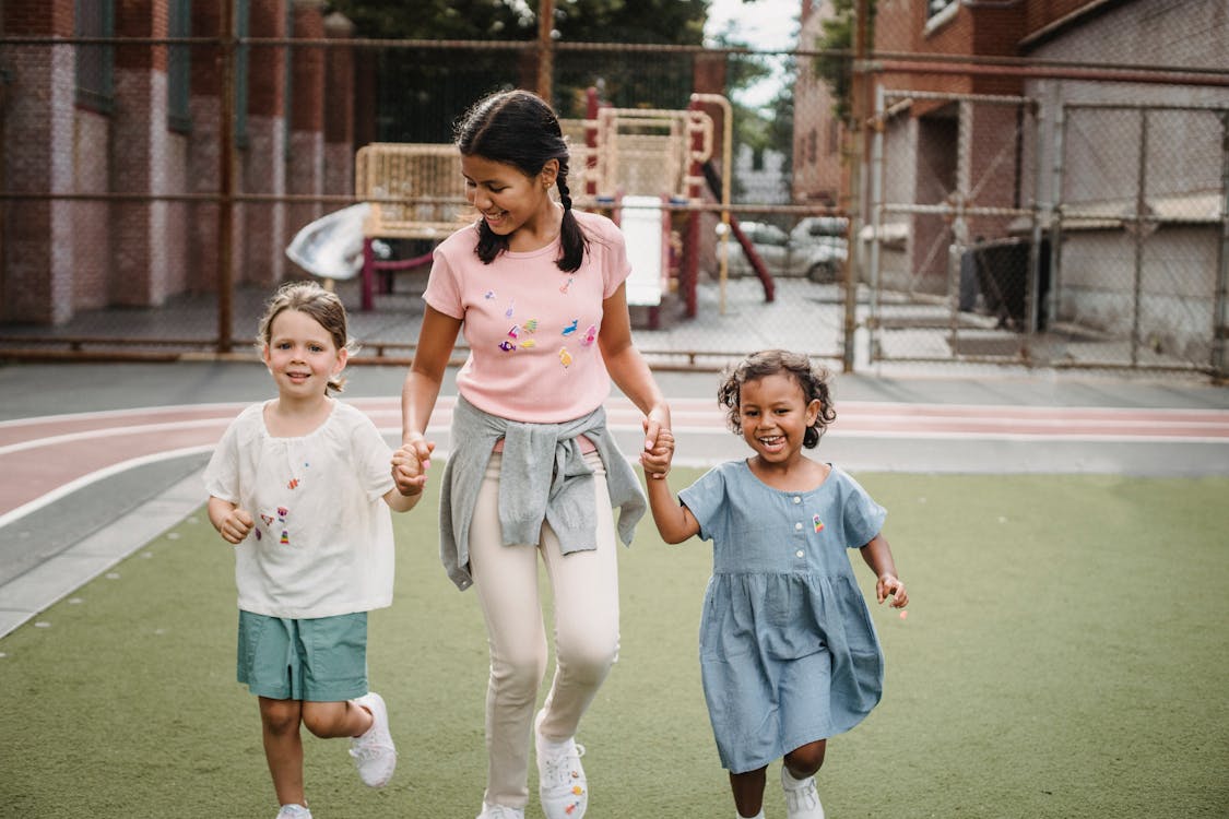 Free Girls Playing on the Playground Stock Photo