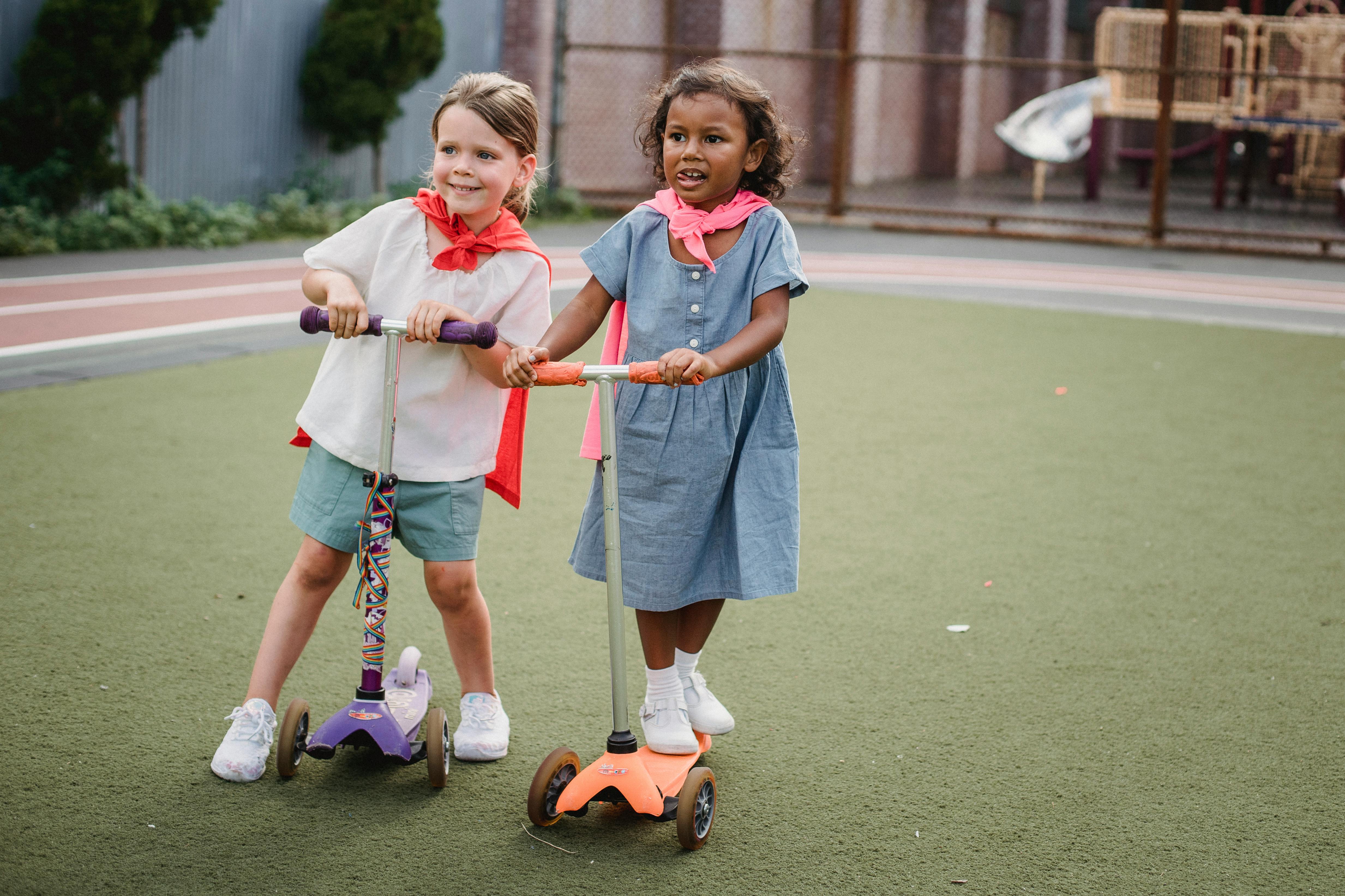 Kids playing best sale scooter