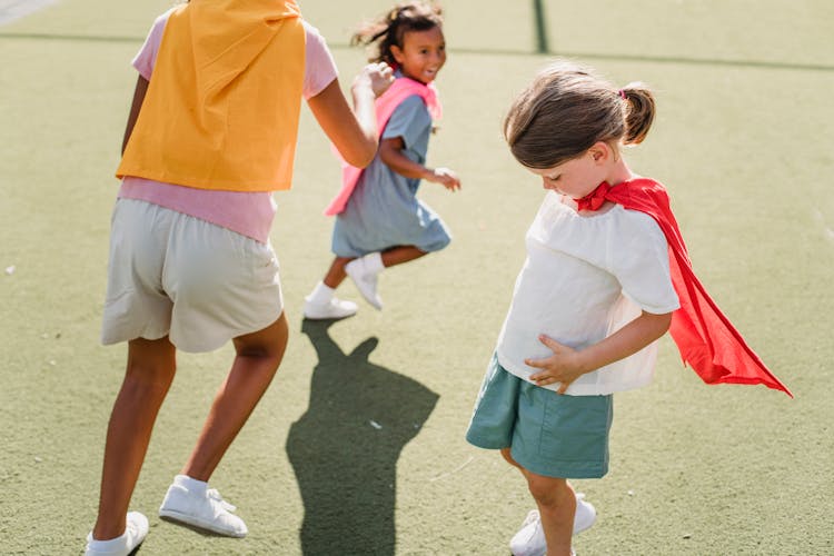 Girls Running On The Playground