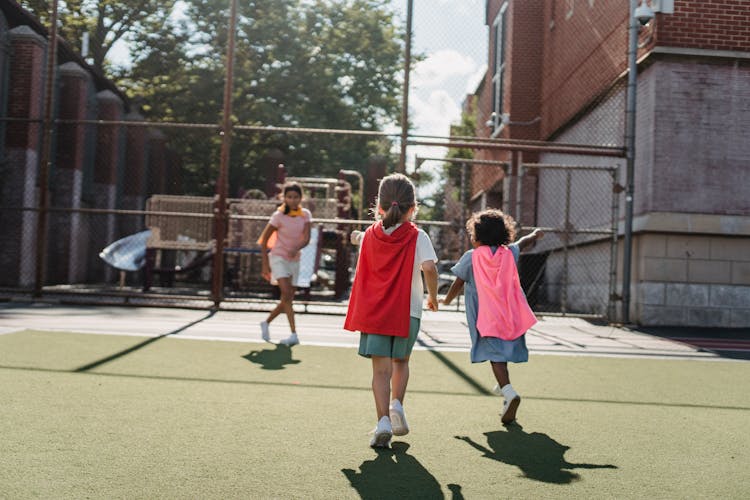 Girls Running On The Playground