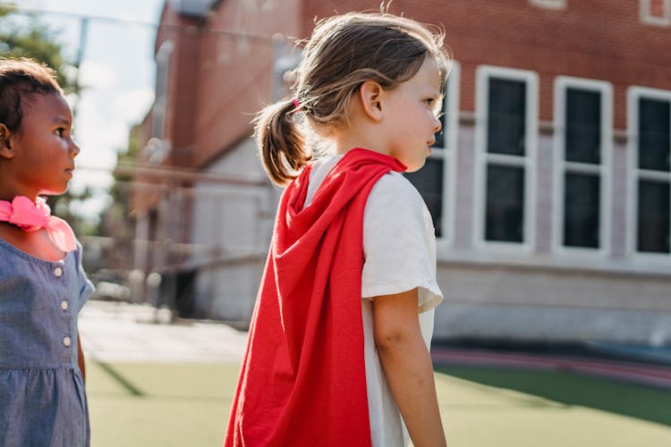 A Girl Wearing A Red Cape