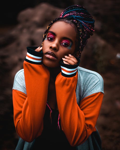 A Woman with Braided Hair Wearing a Jacket