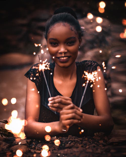 A Woman Holding Sparklers