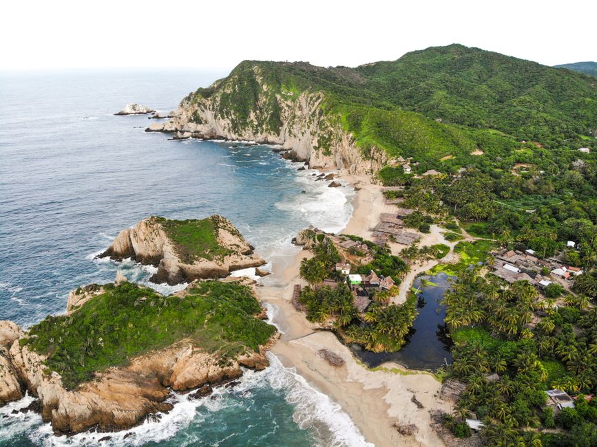 Amazing Jungle ATV Adventure: Unveiling Akumal's Enchanting Cenotes Review 2026 - Stunning aerial view of Mexico's coastline with lush greens and rocky cliffs.
