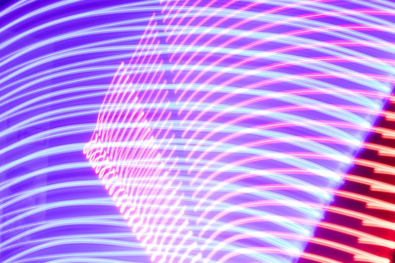 Vibrant purple neon light trails abstract digital art