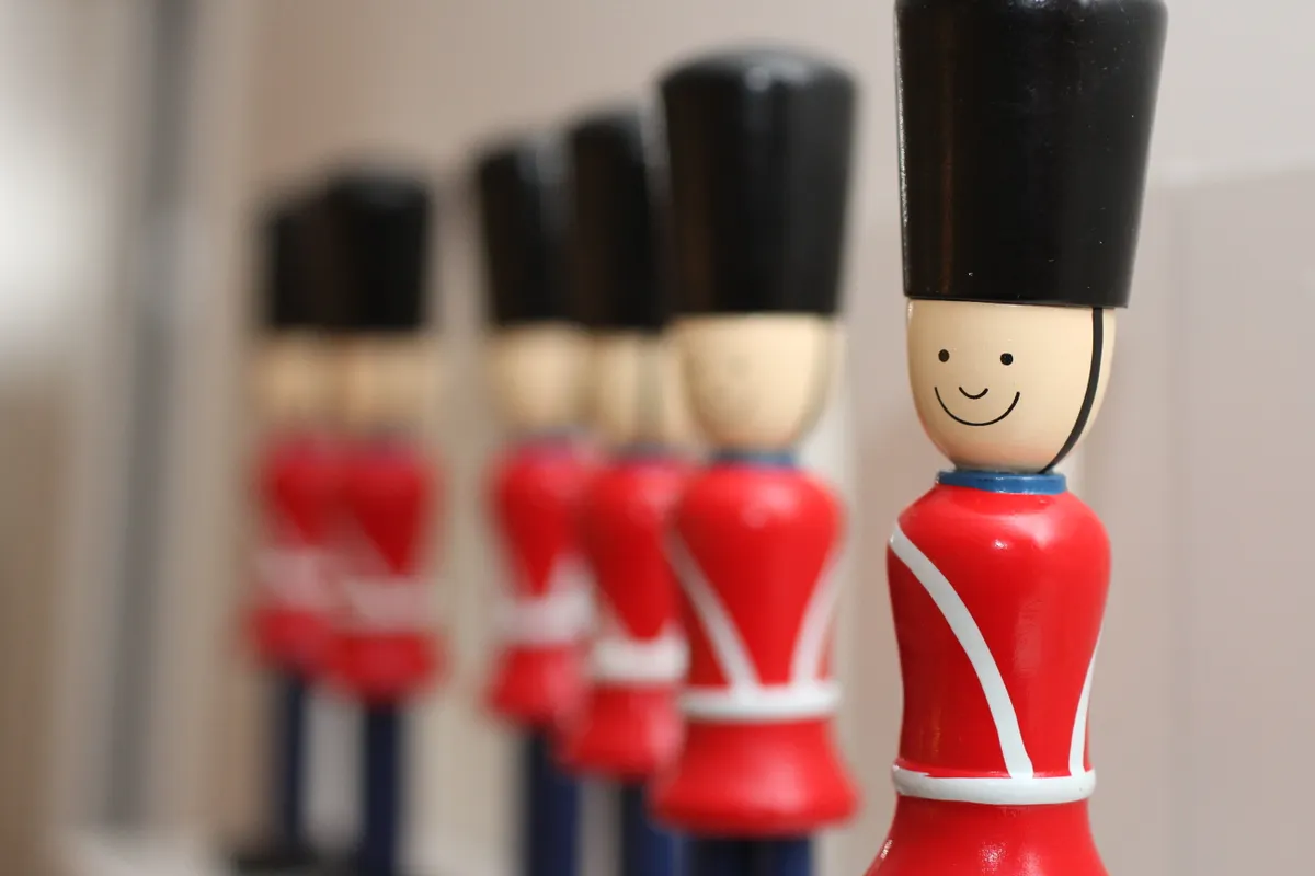 Wooden toy soldiers in a row, representing repetitive content from an AI article generator.