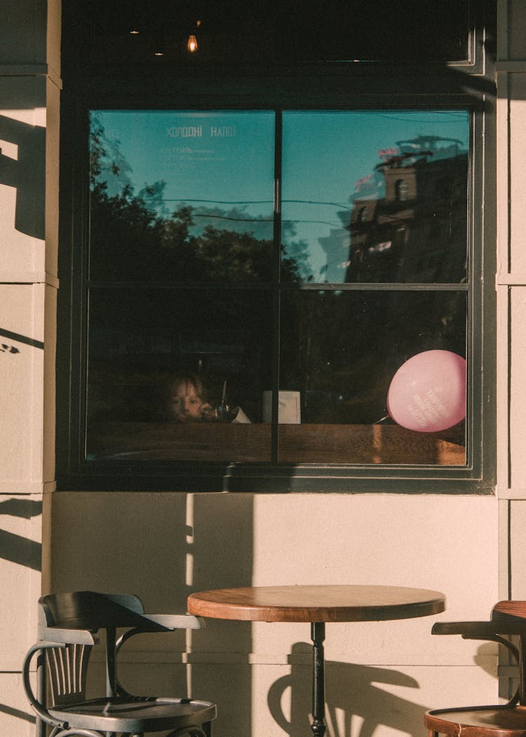 Young Girl Peeking On A Window 