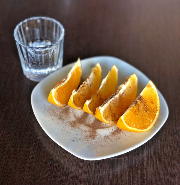 Orange Wedges On White Plate