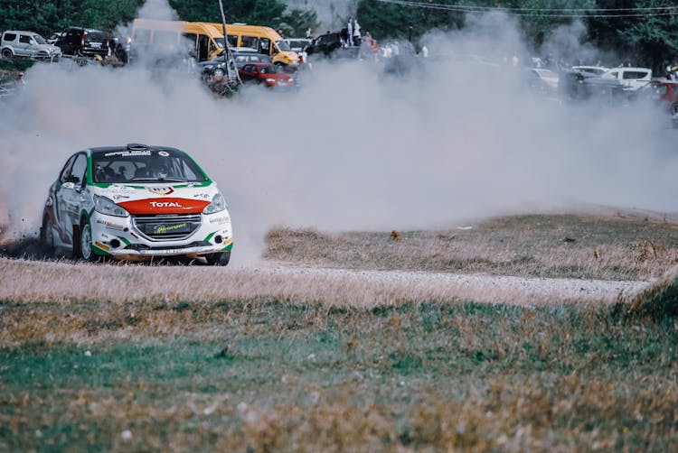 A World Rally Car Leaving A Dust Cloud