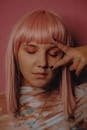 Young stylish woman with pink hairstyle