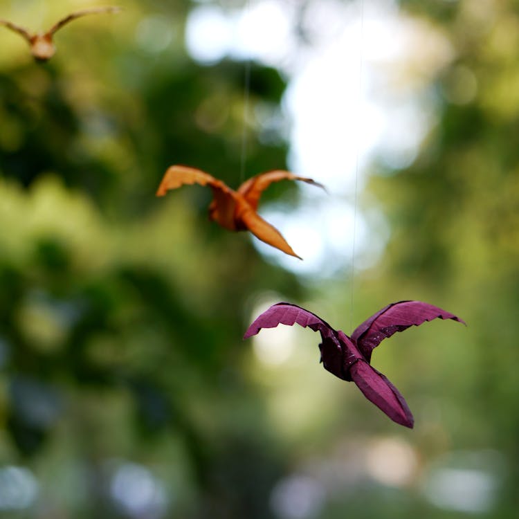 Bird Origami Suspended In Midair With Strings