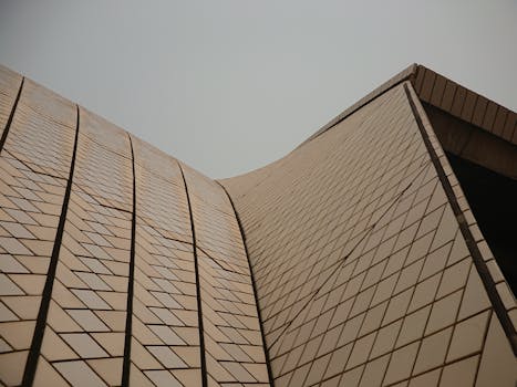 Close-up of the iconic tiled roof pattern of the Sydney Opera House, showcasing its unique architecture.