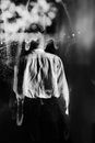 Grayscale Photo of Man in Dress Shirt and Pants