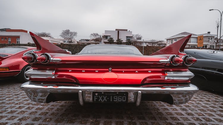 Red Pontiac Car Parked On The Parking Lot