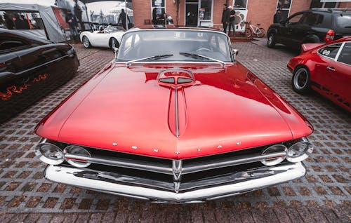 Red Pontiac Car Parked on Street