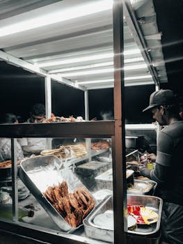 A vibrant street food stall in Colombo's night market, showcasing local delicacies.