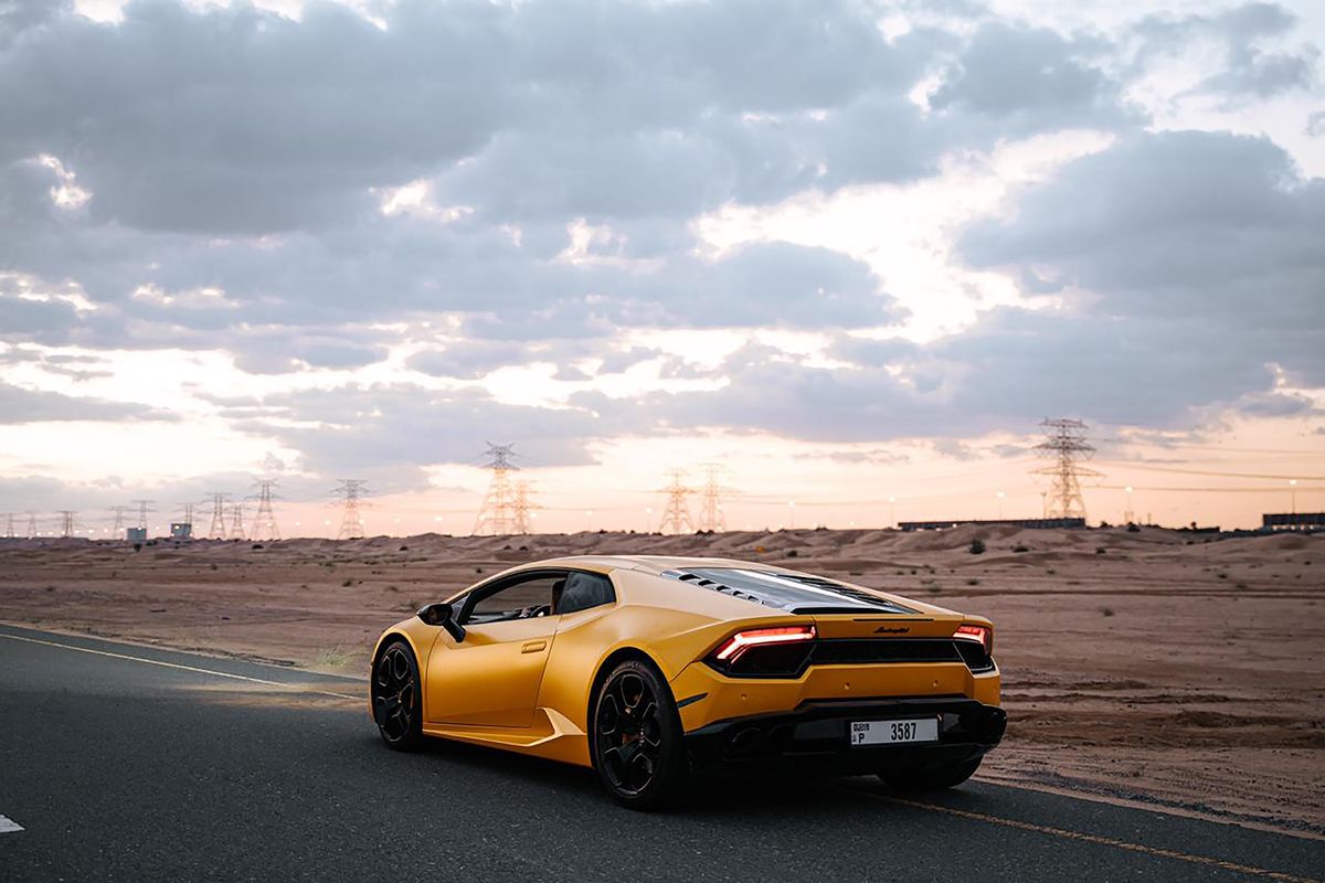 Lamborghini Huracan on scenic road at sunset