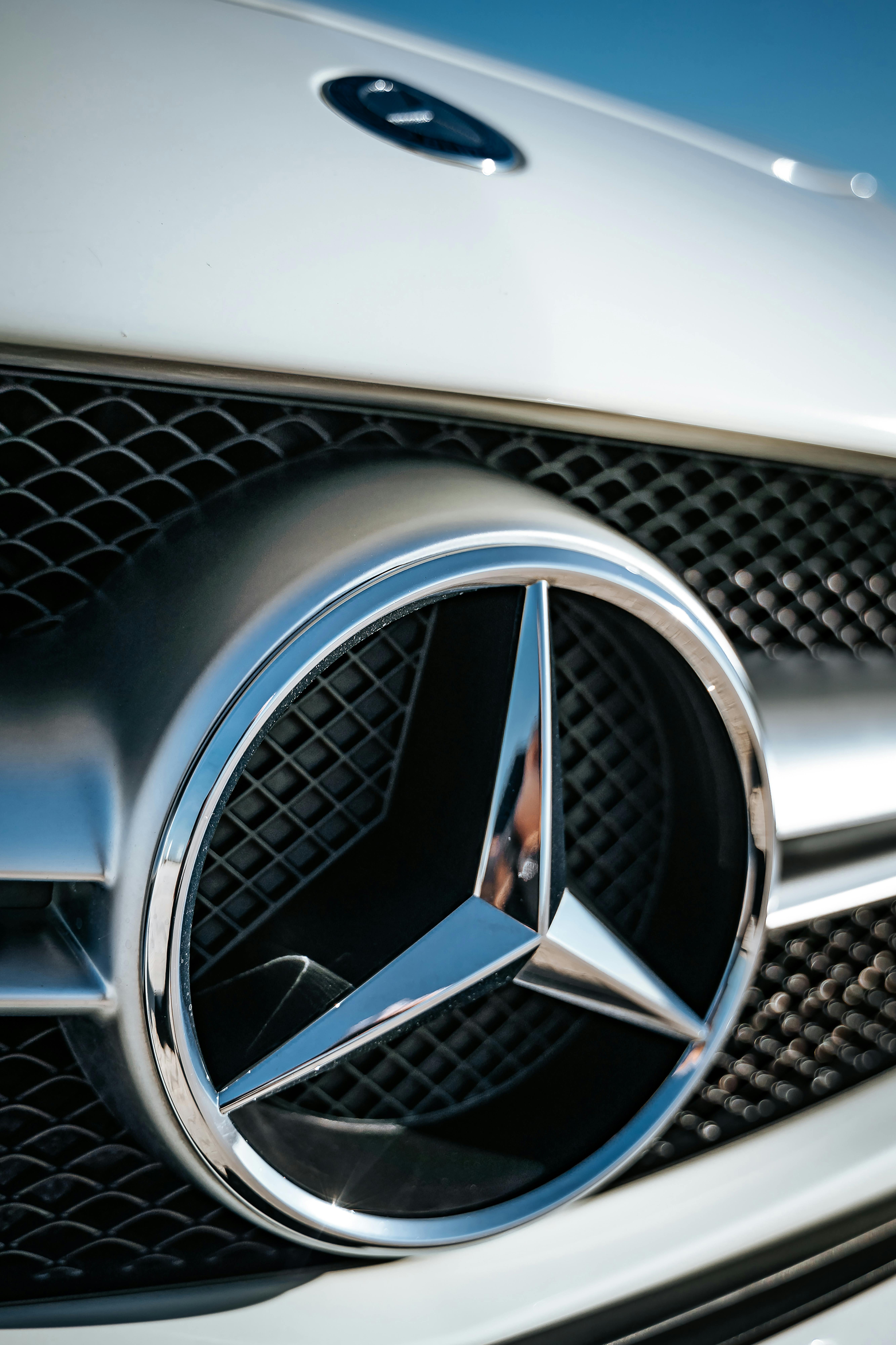 A Mercedes Benz Emblem · Free Stock Photo