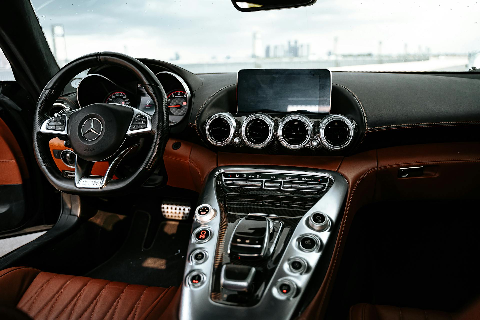 Elegantly designed Mercedes interior featuring leather and chrome highlights. Perfect for car enthusiasts.