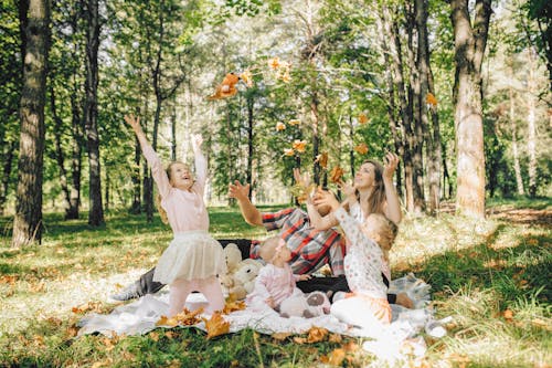 Free Happy Family on a Picnic Blanket Stock Photo