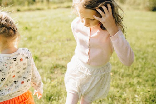 Close-up Photo of Children on Grass 