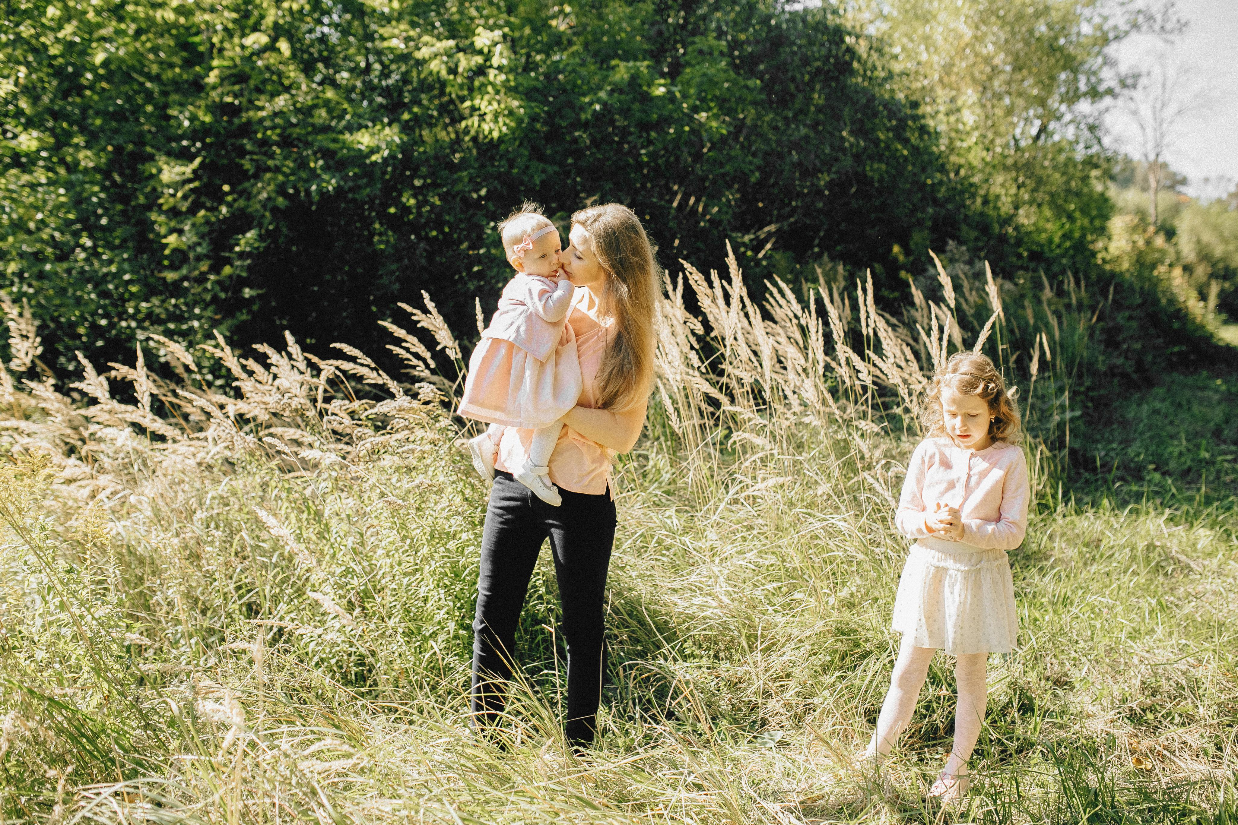 Free 2 Girls Standing on Green Grass Field Stock Photo