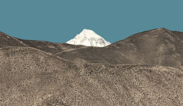 Breathtaking view of a pristine snow-covered peak in Nepal's Himalayas under a clear blue sky.
