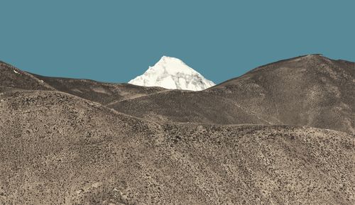 Free Breathtaking view of a pristine snow-covered peak in Nepal's Himalayas under a clear blue sky. Stock Photo