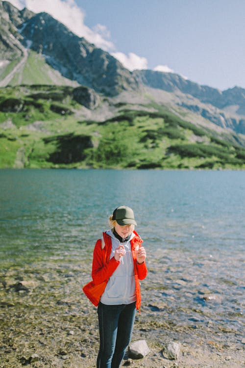 Backpacker standing on a Lakeside